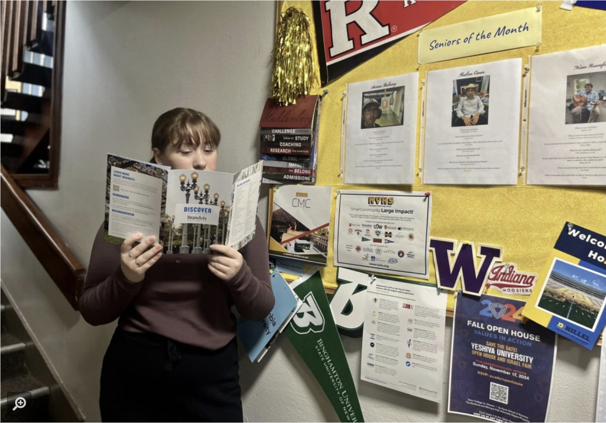 Ariana Balkany reviews college options at the senior bulletin board.